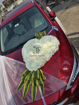 Elegant white flower wedding car decoration with fresh floral arrangements for Indian weddings