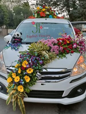 Colorful wedding car decoration with mixed fresh flowers for Indian weddings