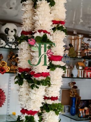 Royal floral mala with fresh flowers for spiritual celebrations