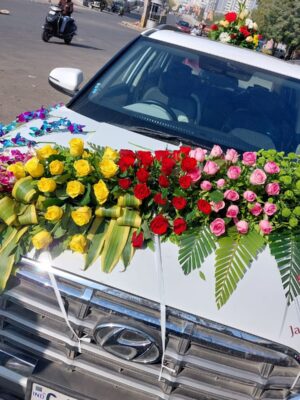 Premium mixed flower wedding car decoration with fresh floral arrangements