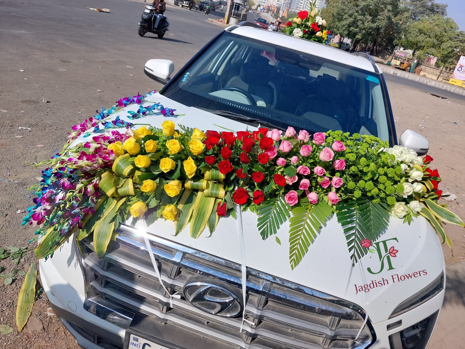 Premium mixed flower wedding car decoration with fresh floral arrangements