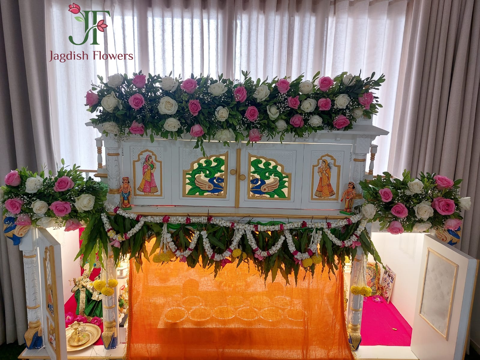 Elegant home temple flower decoration with fresh floral arrangements for pooja ceremonies