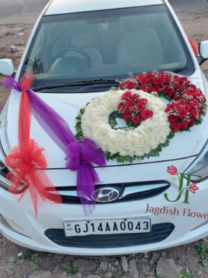 Elegant red rose wedding car decoration with fresh flowers for Indian weddings