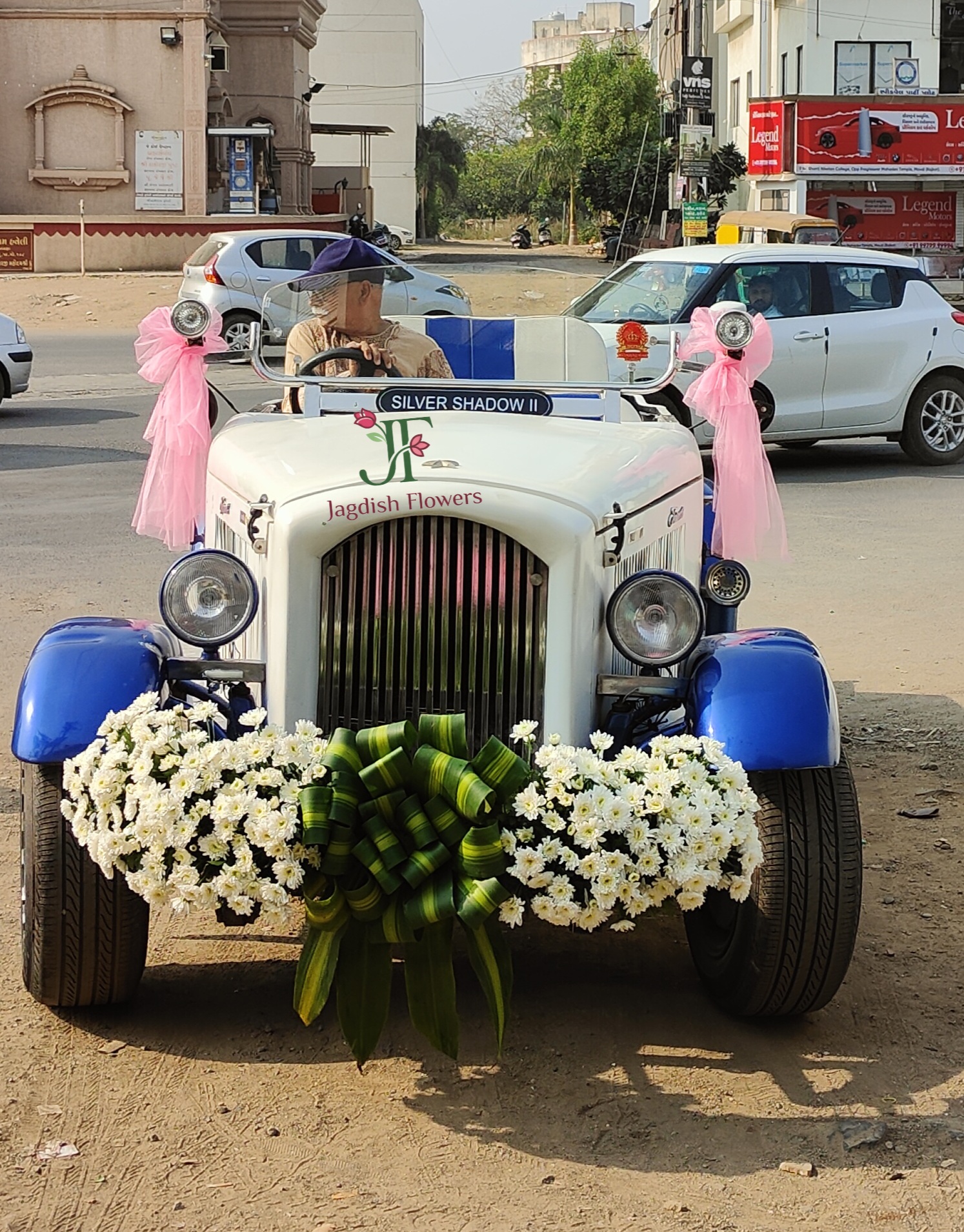 Vintage wedding car decoration with fresh white flowers for bridal entry car