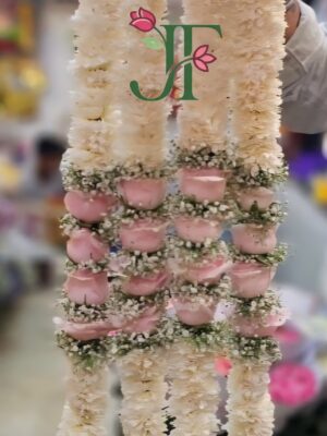 Elegant fresh rose garland featuring premium floral arrangements for festive occasions, pooja functions, mandir decoration, and spiritual celebrations with luxurious handcrafted flower decoration.