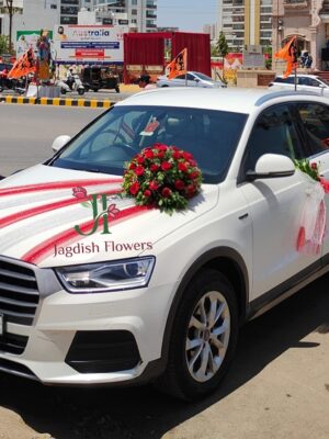 Red rose wedding car decoration with fresh floral arrangements for Indian weddings