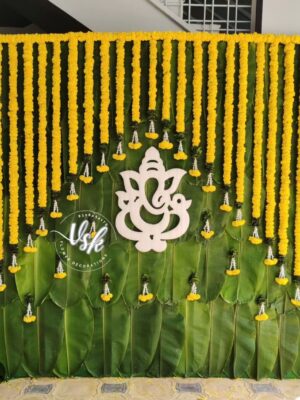 Traditional marigold mandap decoration with fresh flowers and floral backdrop