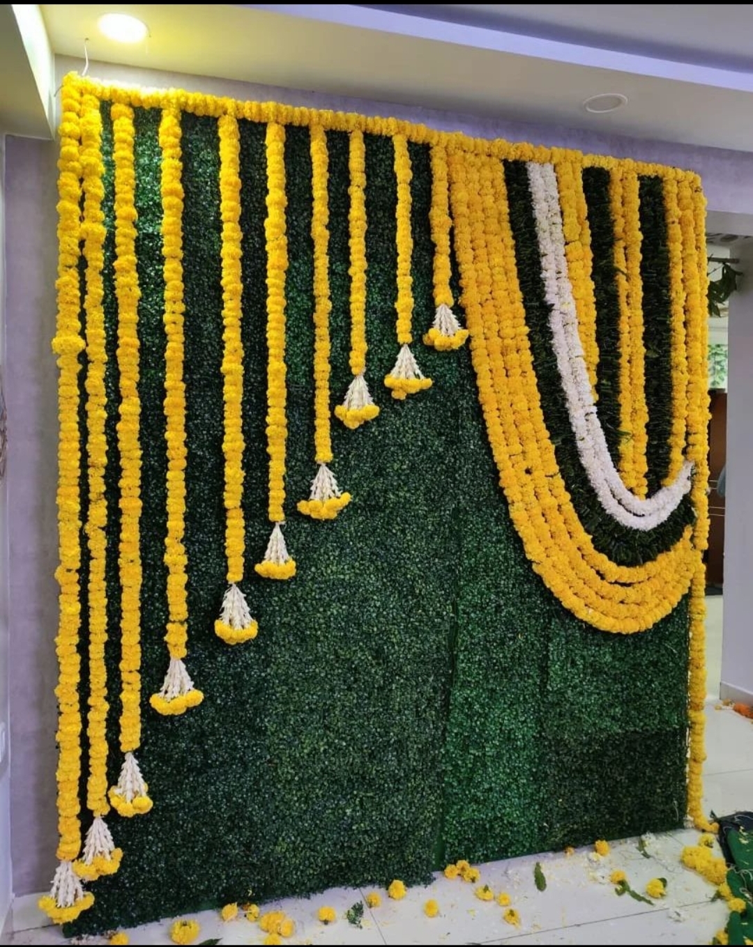 Premium floral mandap backdrop decoration with marigold flower garlands
