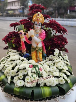 Royal floral tray decoration with fresh roses and krishna statue for wedding celebrations