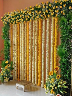 Elegant haldi ceremony flower decoration with marigold backdrop