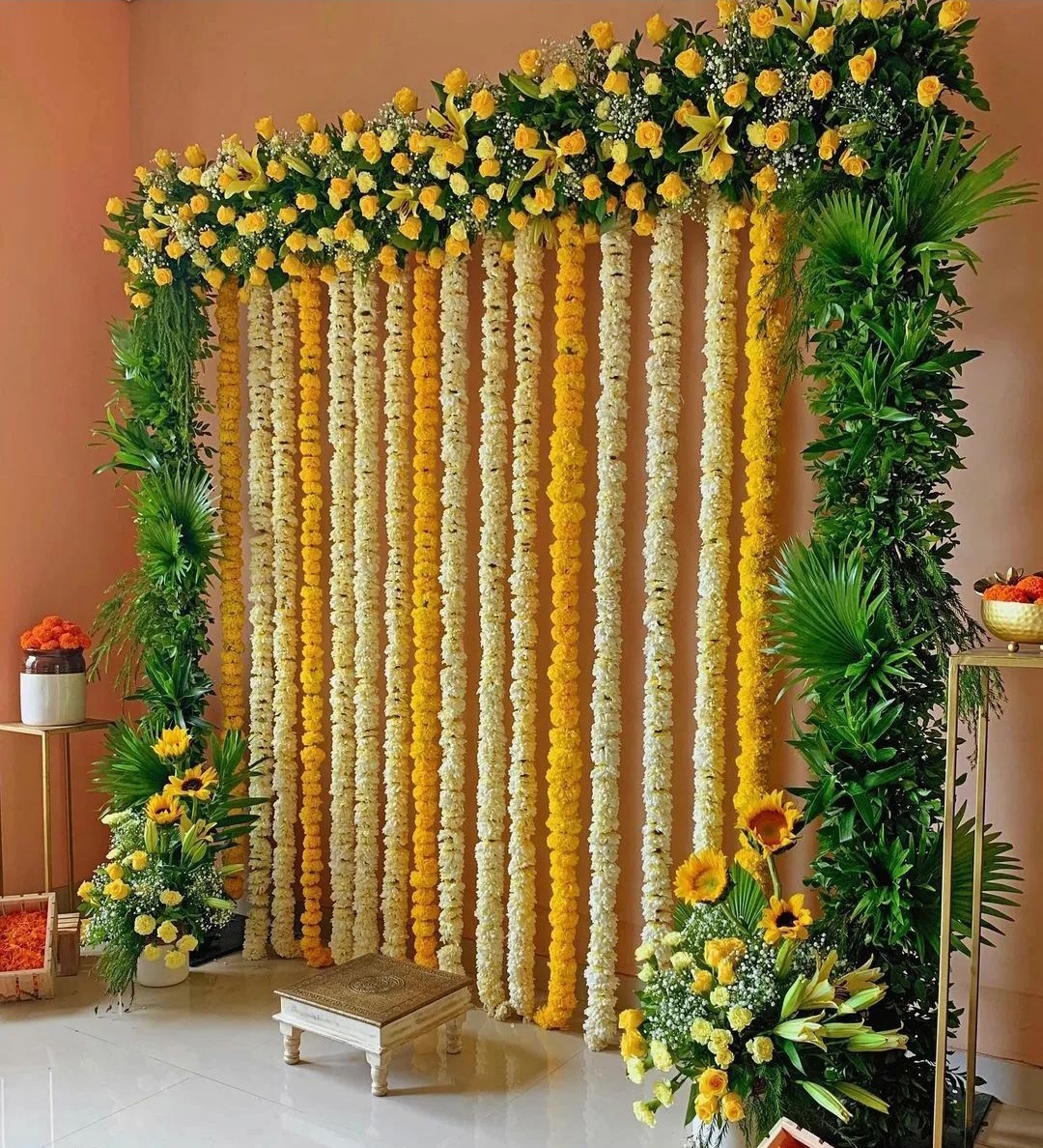 Elegant haldi ceremony flower decoration with marigold backdrop