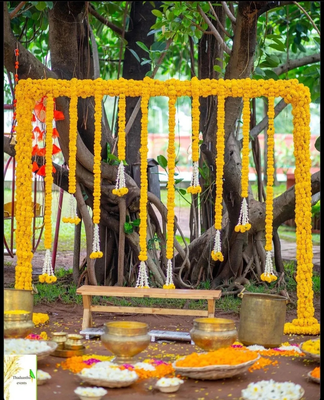 Floral Ganesh mandap decoration with marigold flowers and banana leaves