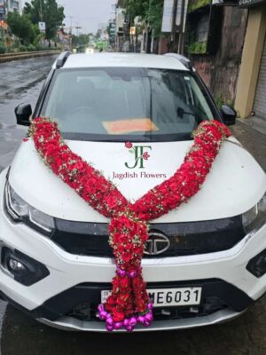 Designer big haar with fresh flowers for new vehicle celebration