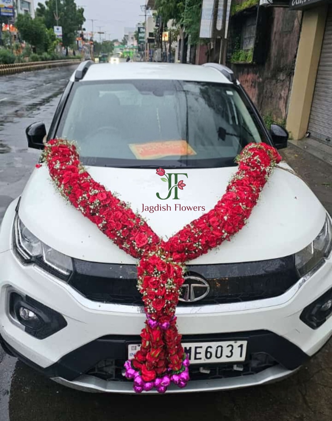 Designer big haar with fresh flowers for new vehicle celebration