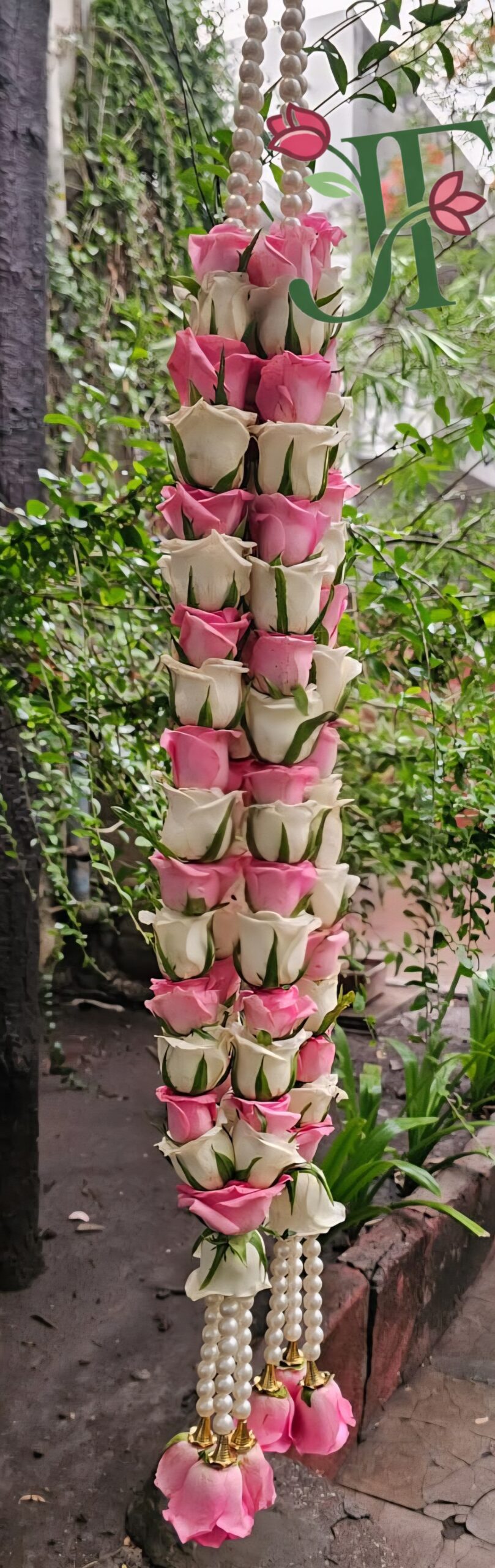 Traditional fresh rose garland for religious ceremonies and pooja decoration