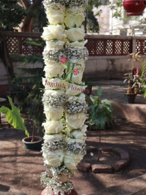 Traditional wedding garland with fresh floral styling