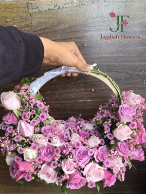 Pink rose purse bouquet flower arrangement by Jagdish Flowers Rajkot