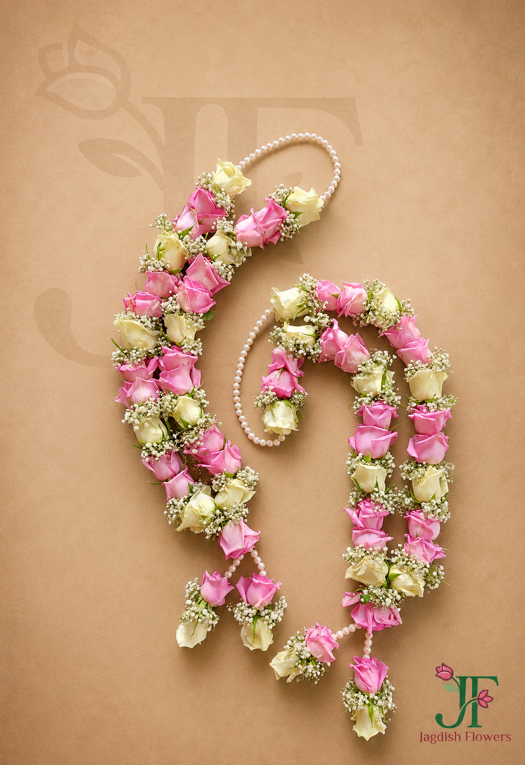 Premium pink and white rose wedding varmala handcrafted with fresh flowers for a traditional marriage ceremony in Rajkot.