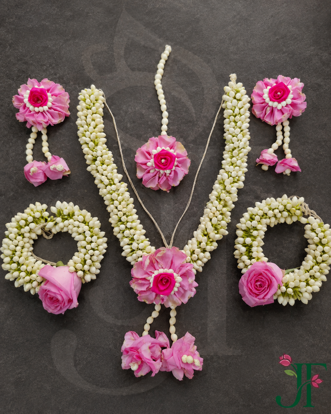 Tagar and Pink Rose Flower Ornament at Jagdish Flowers