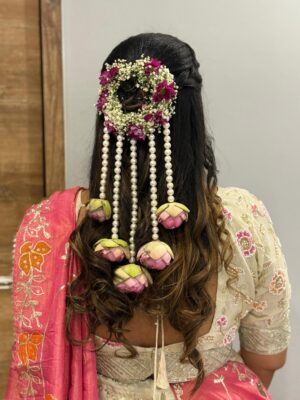 Fresh floral Hari Broche and Veni bridal wedding hair accessory with traditional flower detailing in Rajkot