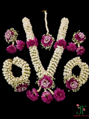 Handcrafted Tagar, dark purple button Sevanti, and Gypsophila floral jewellery set with necklace, earrings, maang tikka, bracelet, waist belt, and hair accessories for Haldi and Mehndi in Rajkot