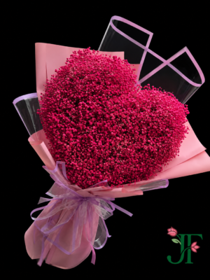 Elegant dark pink Gypsophila heart bouquet wrapped in transparent and light pink premium paper with satin ribbon for romantic gifting in Rajkot